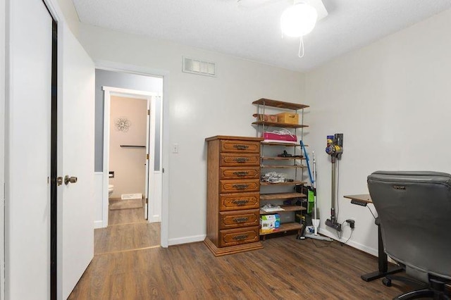 108 Sunrise Ct, Ozawkie, KS 66070 - home office featuring baseboards, a ceiling fan, wood finished floors, and visible vents