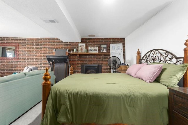 108 Sunrise Ct, Ozawkie, KS 66070 - bedroom featuring brick wall, visible vents, and carpet