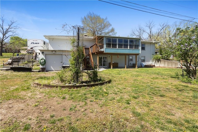 108 Sunrise Ct, Ozawkie, KS 66070 - back of house with fence, a lawn, a sunroom, and stairs