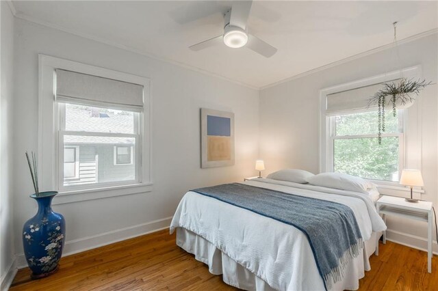 7235 Main St, Kansas City, MO 64114 - bedroom with crown molding, wood finished floors, and ceiling fan
