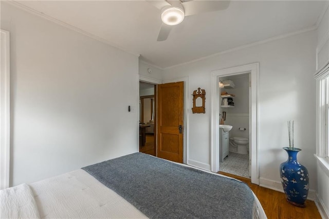 7235 Main St, Kansas City, MO 64114 - bedroom featuring wood finished floors, ornamental molding, ceiling fan, and ensuite bathroom