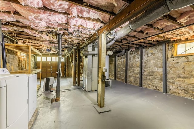7235 Main St, Kansas City, MO 64114 - below grade area featuring washing machine and clothes dryer and healthy amount of natural light