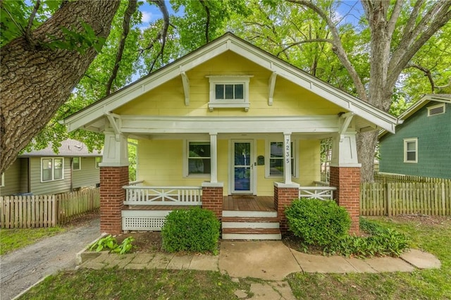 7235 Main St, Kansas City, MO 64114 - view of front of house featuring a porch