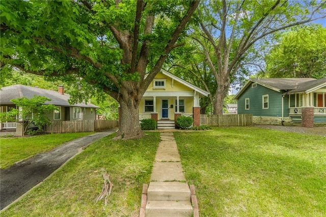 7235 Main St, Kansas City, MO 64114 - bungalow-style home featuring a porch