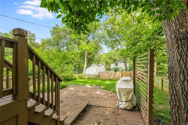7235 Main St, Kansas City, MO 64114 - wooden terrace with a fenced backyard, stairway, and grilling area