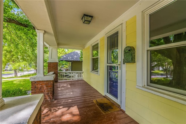 7235 Main St, Kansas City, MO 64114 - view of wooden porch