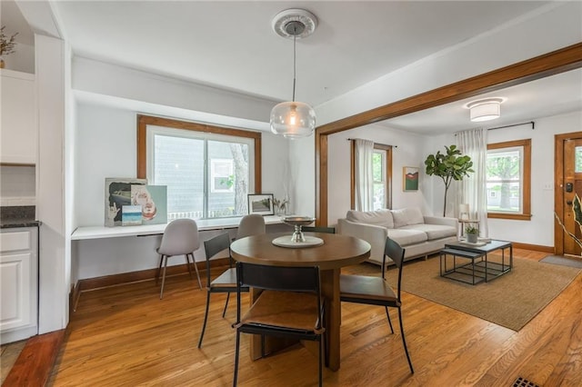 7235 Main St, Kansas City, MO 64114 - dining space with light wood-style flooring