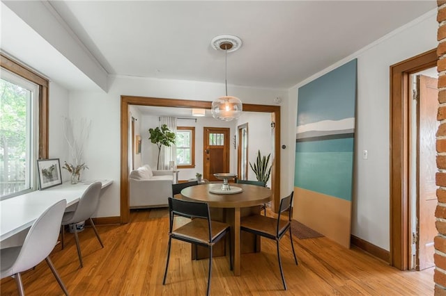 7235 Main St, Kansas City, MO 64114 - dining area featuring light wood-style floors, healthy amount of natural light, and a desk