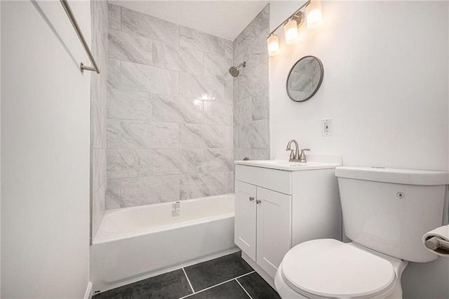 bathroom with tile patterned floors, vanity, toilet, and tub / shower combination