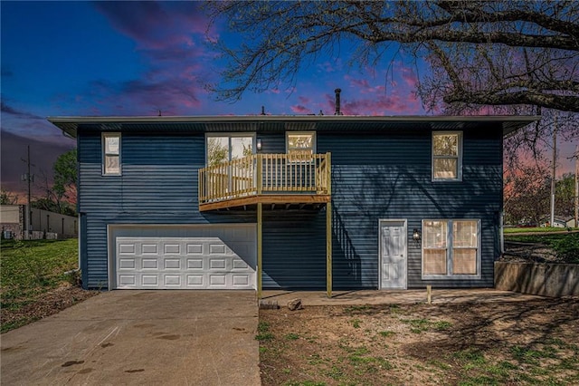 5207 Blue Rdg, Cut Off, Raytown, MO 64133 - view of front of house featuring a balcony, concrete driveway, and an attached garage