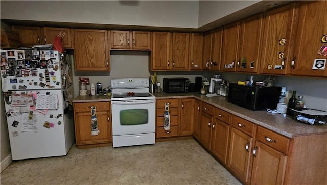 507 E Monroe St, Pittsburg, KS 66762 - kitchen featuring brown cabinets, a toaster, and white appliances