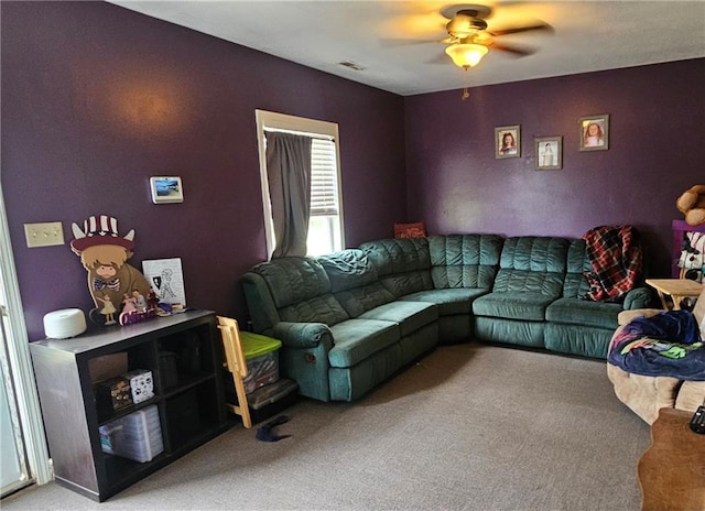 507 E Monroe St, Pittsburg, KS 66762 - living room with visible vents, a ceiling fan, and light carpet