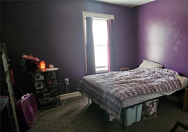 507 E Monroe St, Pittsburg, KS 66762 - carpeted bedroom featuring baseboards