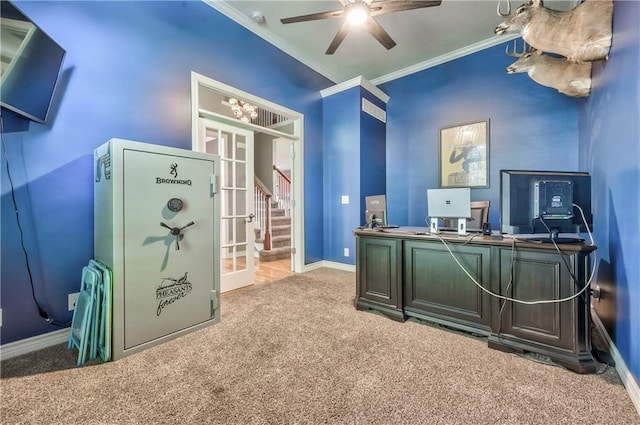 carpeted office featuring crown molding, baseboards, and ceiling fan