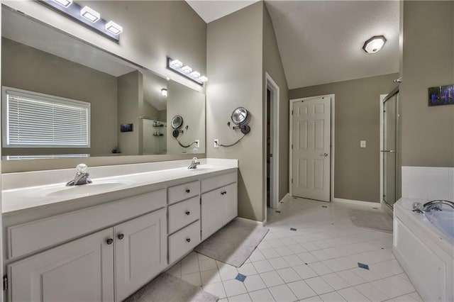 full bath with a sink, tile patterned floors, and a shower stall