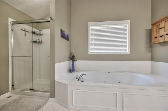 full bath with tile patterned flooring, a shower stall, a tub with jets, and a textured ceiling