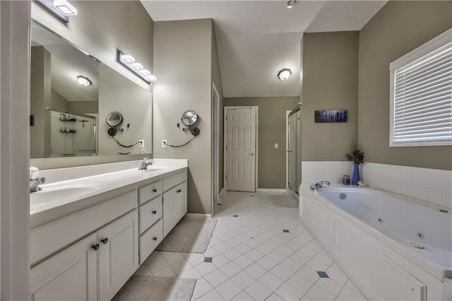 full bathroom featuring a sink, a whirlpool tub, and a shower stall