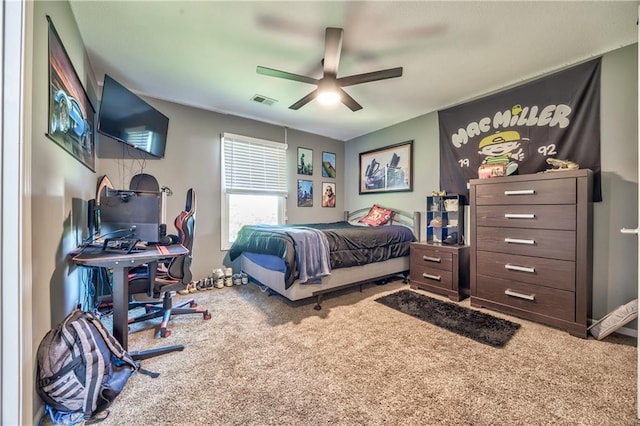 bedroom featuring visible vents, carpet flooring, and ceiling fan