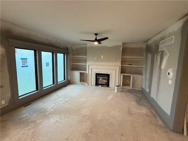 7080 NW Forest Lakes Dr, Parkville, MO 64152 - unfurnished living room featuring a ceiling fan and a fireplace