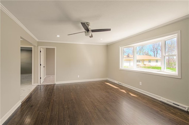 3422 N 71st St, Kansas City, KS 66109 - unfurnished room with baseboards, visible vents, dark wood-style floors, and ornamental molding