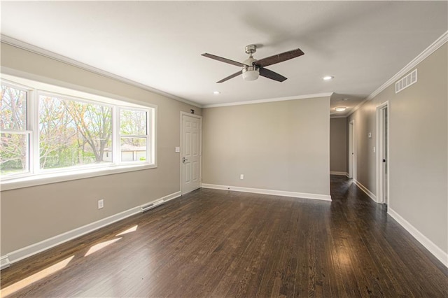 3422 N 71st St, Kansas City, KS 66109 - spare room featuring dark wood finished floors, visible vents, a ceiling fan, crown molding, and baseboards