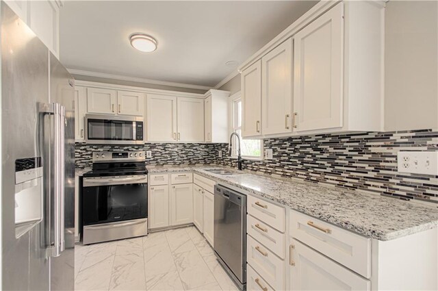 3422 N 71st St, Kansas City, KS 66109 - kitchen featuring tasteful backsplash, marble finish floor, stainless steel appliances, and a sink