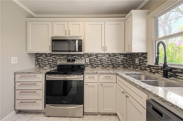 3422 N 71st St, Kansas City, KS 66109 - kitchen featuring a sink, marble finish floor, stainless steel appliances, ornamental molding, and light stone countertops