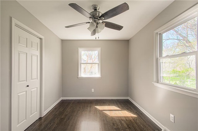 3422 N 71st St, Kansas City, KS 66109 - unfurnished bedroom featuring ceiling fan, baseboards, dark wood-type flooring, and a closet