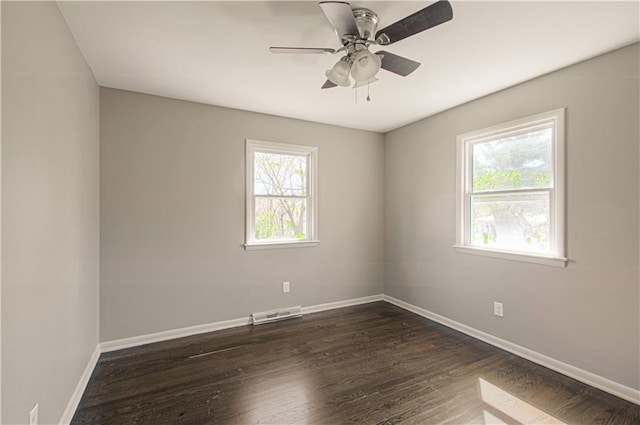 3422 N 71st St, Kansas City, KS 66109 - empty room with ceiling fan, baseboards, dark wood-style flooring, and visible vents
