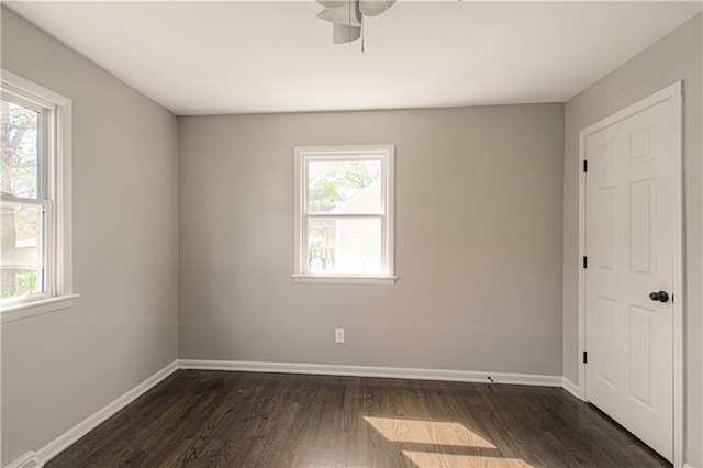 3422 N 71st St, Kansas City, KS 66109 - unfurnished room featuring a ceiling fan, baseboards, and dark wood-type flooring