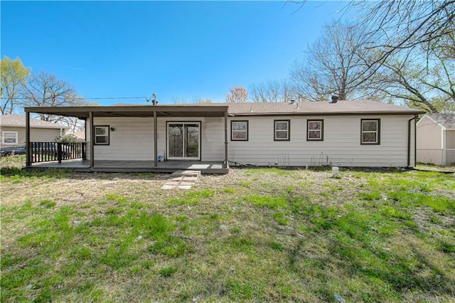 3422 N 71st St, Kansas City, KS 66109 - back of house with a yard