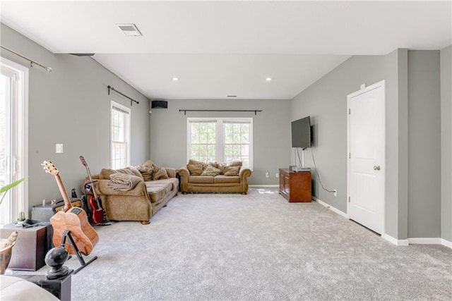 living room featuring recessed lighting, carpet floors, visible vents, and baseboards