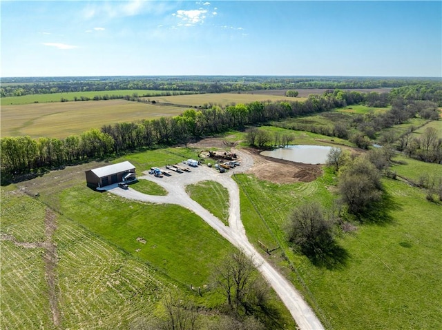 aerial view with a rural view and a water view