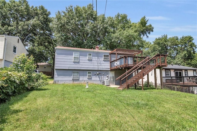 back of house featuring a wooden deck, cooling unit, stairs, and a yard