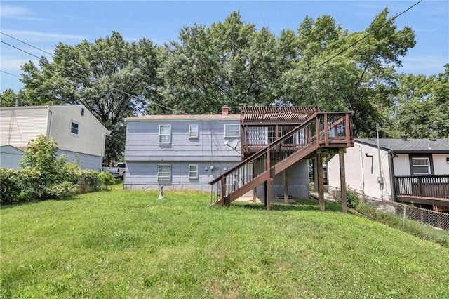 rear view of property with stairs and a wooden deck