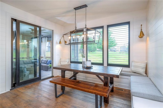 8120 Lone Elm Rd, Lenexa, KS 66220 - dining area featuring dark wood-type flooring and a chandelier