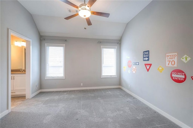 8120 Lone Elm Rd, Lenexa, KS 66220 - carpeted spare room with lofted ceiling, plenty of natural light, ceiling fan, and baseboards
