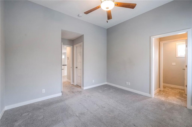 8120 Lone Elm Rd, Lenexa, KS 66220 - empty room featuring ceiling fan, carpet, baseboards, and a smoke detector
