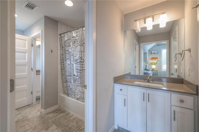 8120 Lone Elm Rd, Lenexa, KS 66220 - bathroom featuring vanity, shower / bath combo with shower curtain, baseboards, and recessed lighting