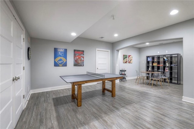 8120 Lone Elm Rd, Lenexa, KS 66220 - game room featuring baseboards, wood finished floors, arched walkways, and recessed lighting