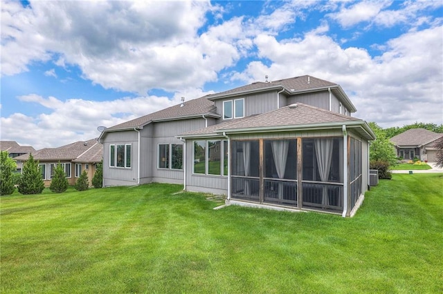 8120 Lone Elm Rd, Lenexa, KS 66220 - back of house with a yard, a sunroom, a shingled roof, and central AC