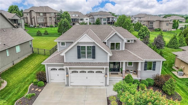 8120 Lone Elm Rd, Lenexa, KS 66220 - view of front facade with concrete driveway, a residential view, roof with shingles, and an attached garage