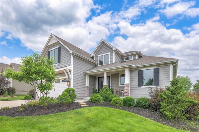 8120 Lone Elm Rd, Lenexa, KS 66220 - view of front of property featuring a garage, a porch, a front yard, and driveway