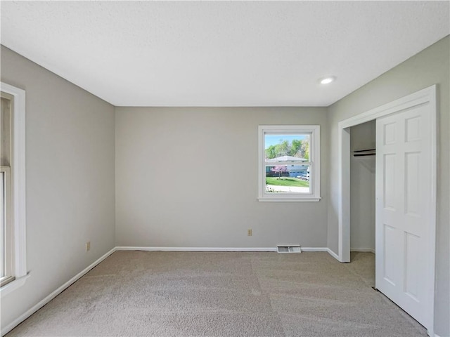 3214 S Hawthorne Ave, Independence, MO 64052 - unfurnished bedroom with visible vents, baseboards, carpet, and a closet