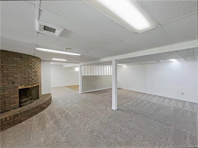 3214 S Hawthorne Ave, Independence, MO 64052 - finished below grade area with carpet and a brick fireplace