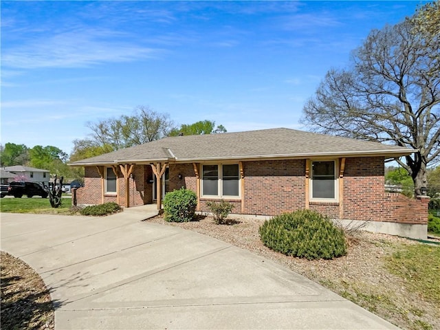 3214 S Hawthorne Ave, Independence, MO 64052 - ranch-style home with brick siding, driveway, and a shingled roof