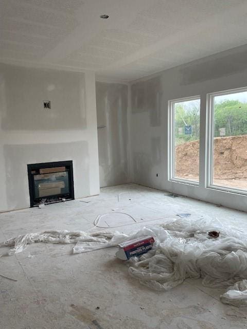 unfurnished living room featuring a fireplace