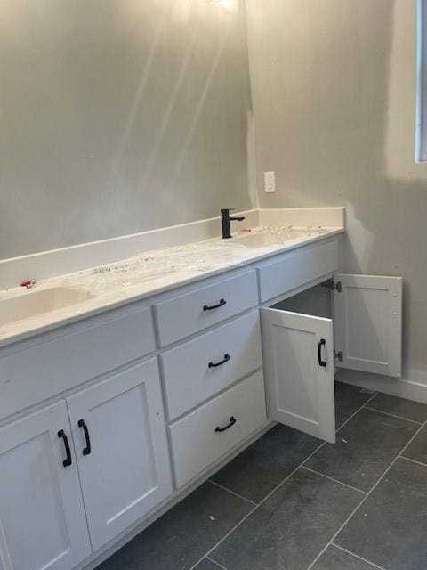 16291 Giorgia St, Parkville, MO 64152 - bathroom featuring double vanity and tile patterned floors