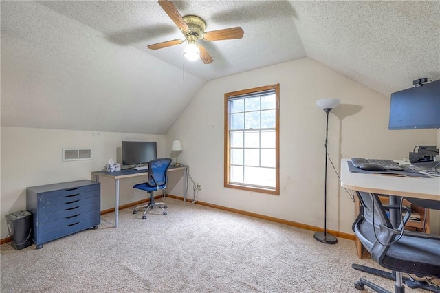 carpeted home office featuring a textured ceiling, lofted ceiling, ceiling fan, and baseboards