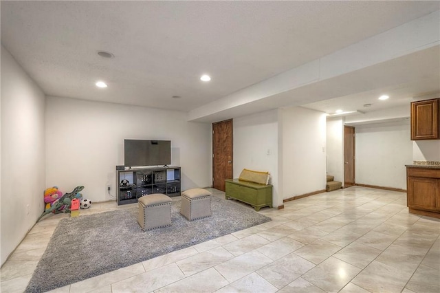 living area with recessed lighting and light tile patterned floors
